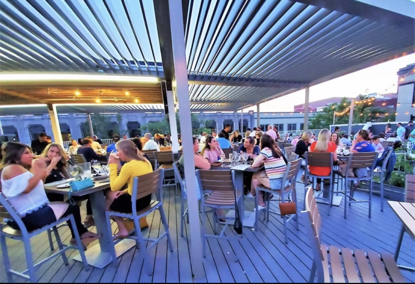 Zef's Rooftop Deck at sunset with diners